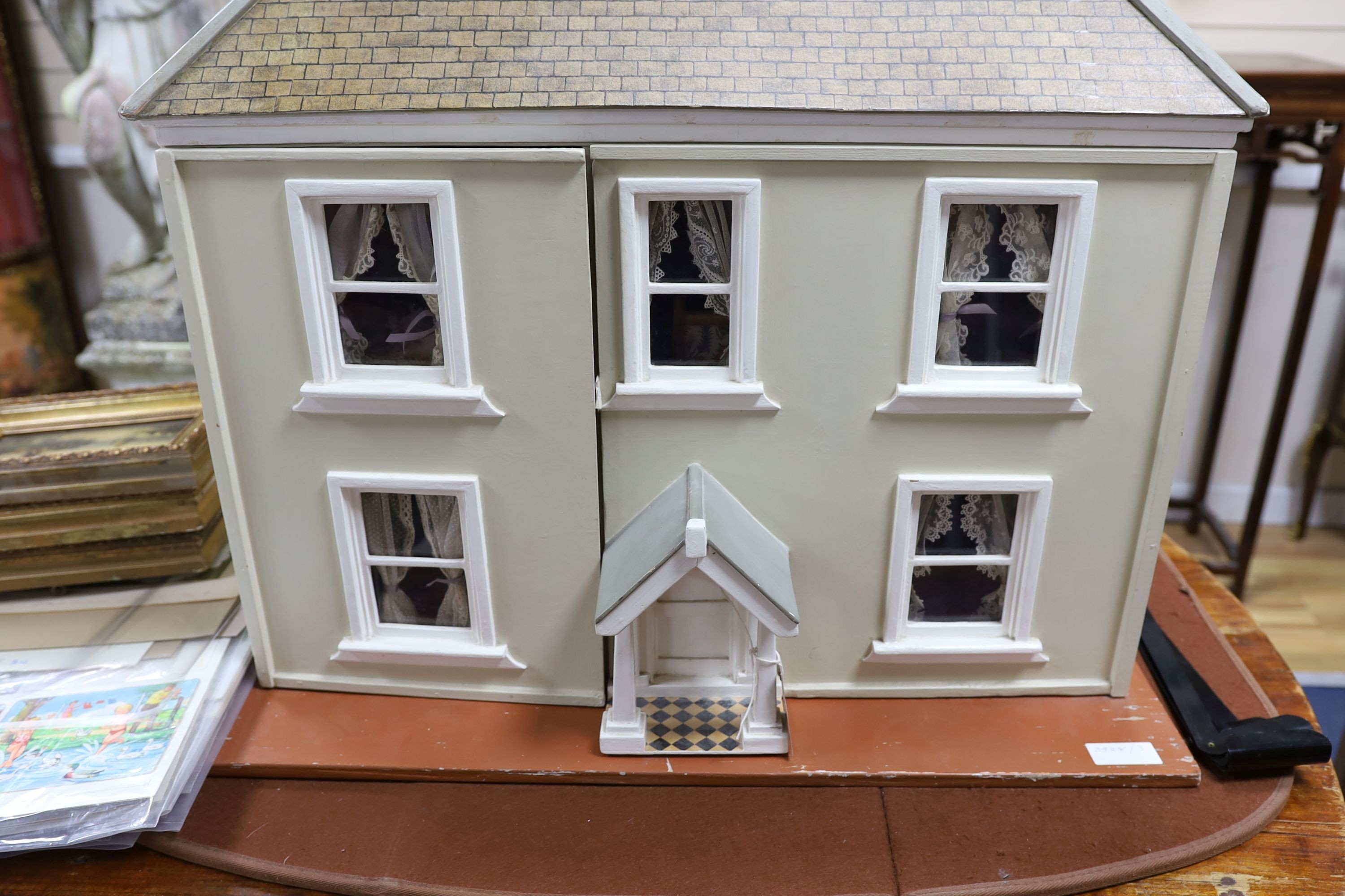 A dolls house, length 74cm, depth 39cm, height 66cm